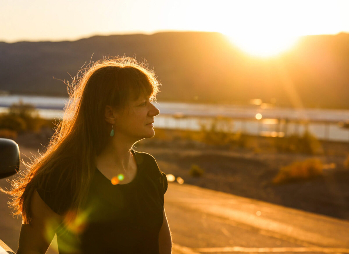 Jaina Moan, Nevada external affairs director for The Nature Conservancy, stands near solar arrays in Eldorado Valley south of Boulder City on Friday, July 20, 2023. (Jeff Scheid/The Nevada Independent)